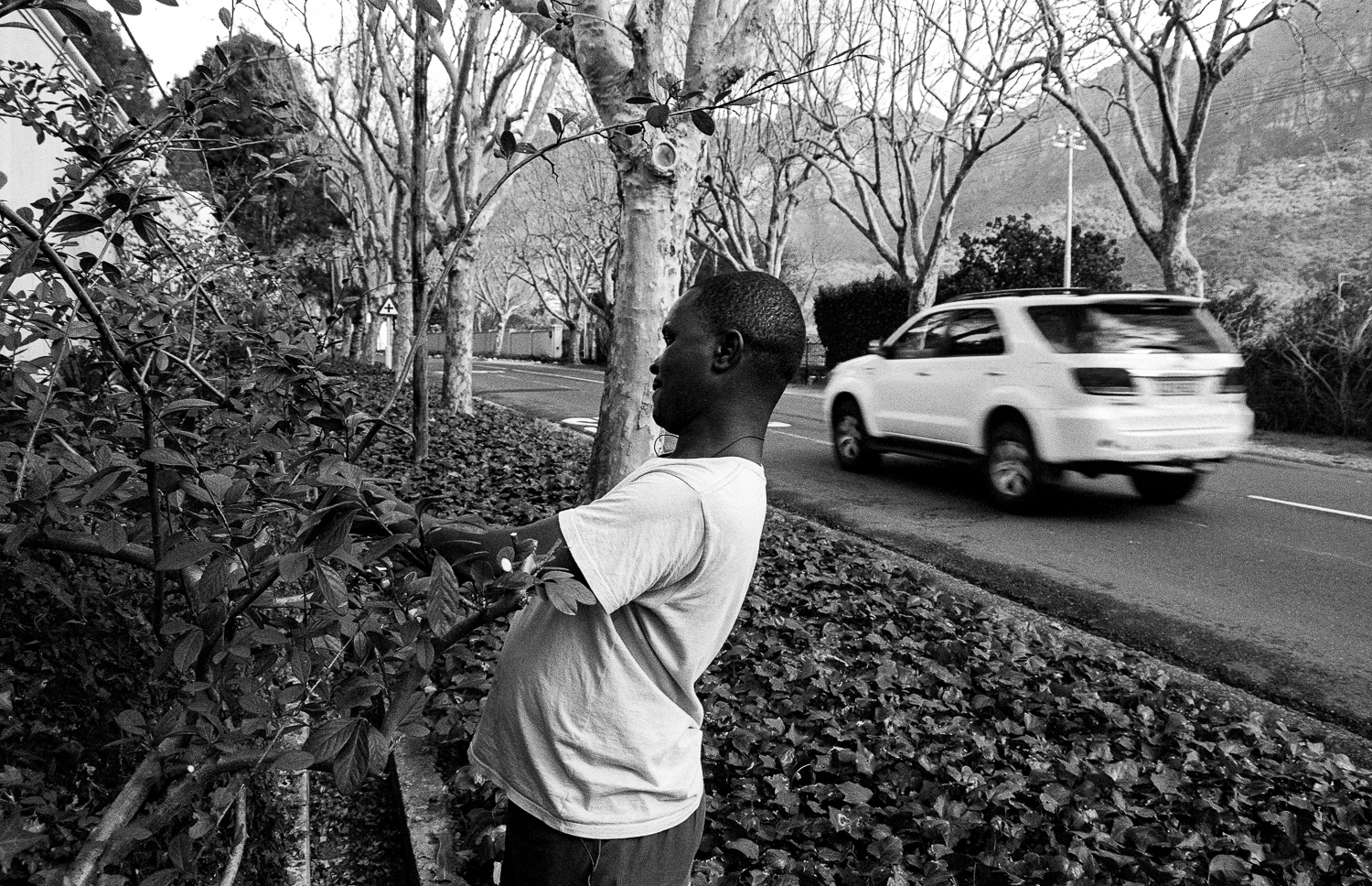 Domestic worker cutting hedges, Bishop’s Court, 2009.